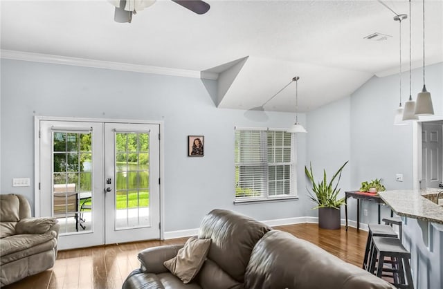 326 Daniel Trent Way, Kingsland, GA 31548 - living area with french doors, ceiling fan, wood finished floors, baseboards, and ornamental molding