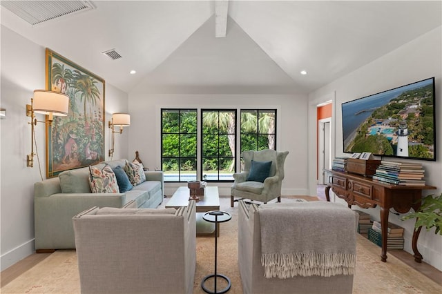 living area with baseboards, visible vents, and recessed lighting