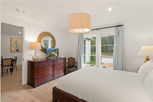 bedroom featuring light wood finished floors and recessed lighting