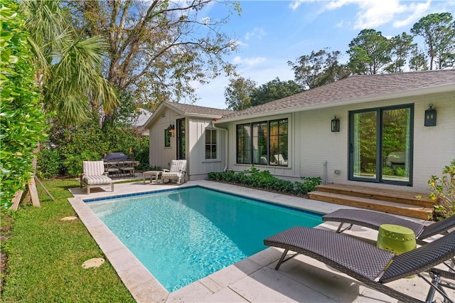 outdoor pool featuring a patio