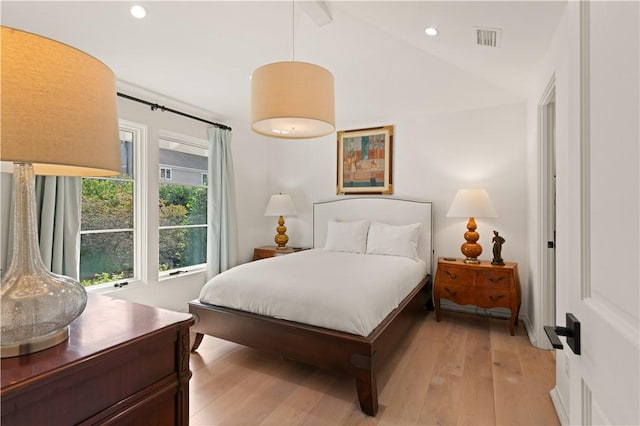 bedroom with lofted ceiling, light wood-style flooring, visible vents, and recessed lighting