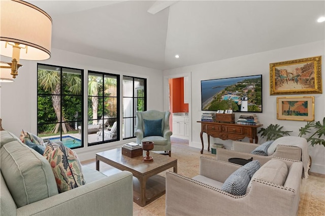 living room with high vaulted ceiling, baseboards, and recessed lighting