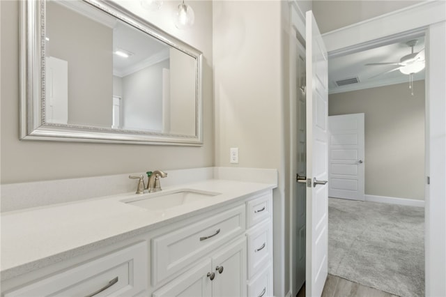 180 Ossabaw Way, Waverly, GA 31565 - bathroom featuring crown molding, vanity, and a ceiling fan