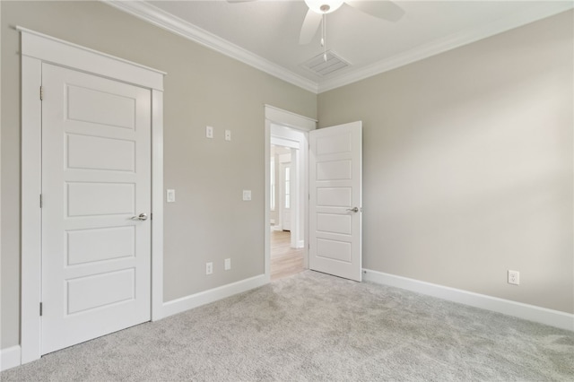 180 Ossabaw Way, Waverly, GA 31565 - unfurnished bedroom featuring carpet flooring, crown molding, and a ceiling fan