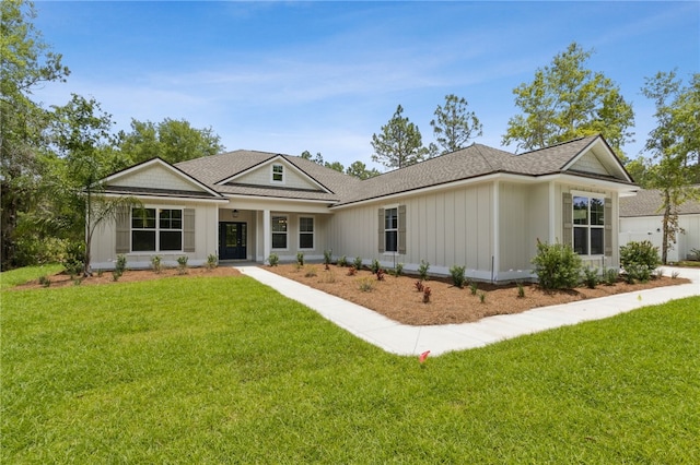 180 Ossabaw Way, Waverly, GA 31565 - view of front of property with a front yard and roof with shingles