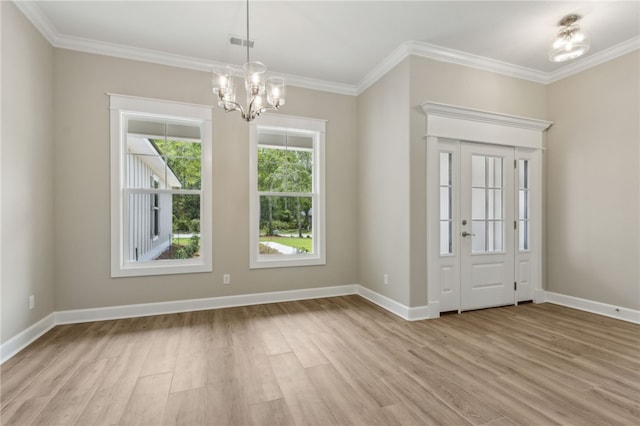 180 Ossabaw Way, Waverly, GA 31565 - foyer with light wood finished floors, ornamental molding, and a chandelier