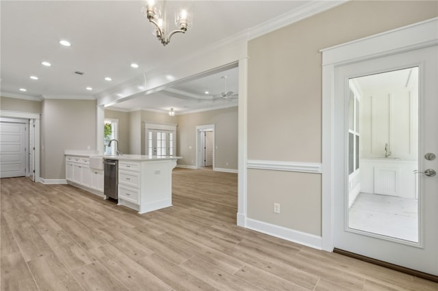 180 Ossabaw Way, Waverly, GA 31565 - kitchen with ornamental molding, white cabinets, light wood-style floors, light countertops, and open floor plan