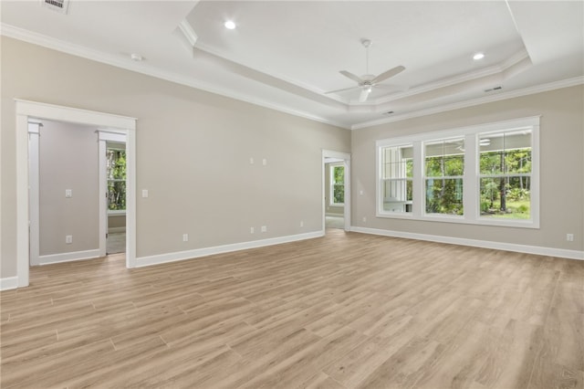 180 Ossabaw Way, Waverly, GA 31565 - spare room featuring a raised ceiling, ceiling fan, ornamental molding, light wood-style flooring, and recessed lighting