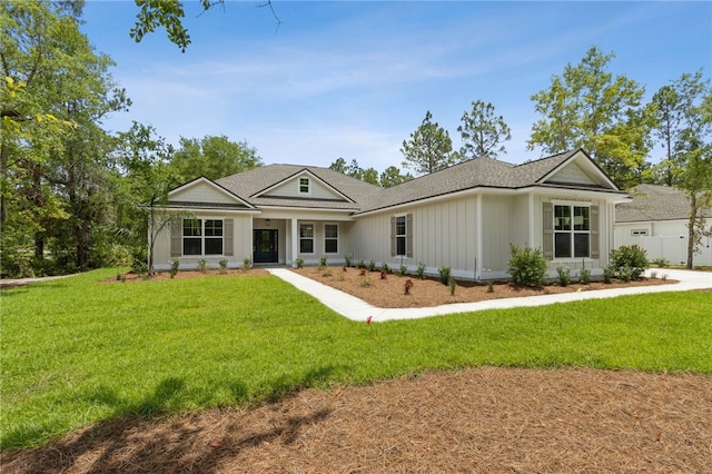 180 Ossabaw Way, Waverly, GA 31565 - view of front of house with a front yard and roof with shingles