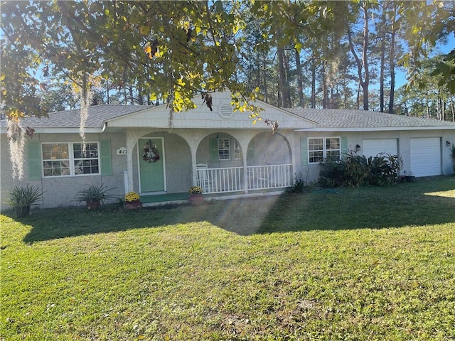417 Blythe Island Dr, Brunswick, GA 31523 - ranch-style house featuring a garage, covered porch, and a front yard