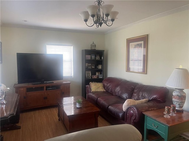 living room featuring crown molding, dark wood-type flooring, and a notable chandelier