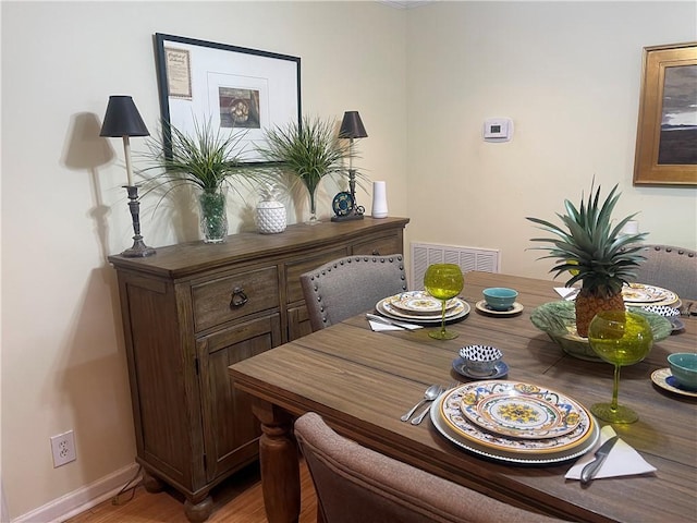 dining area with light wood-type flooring