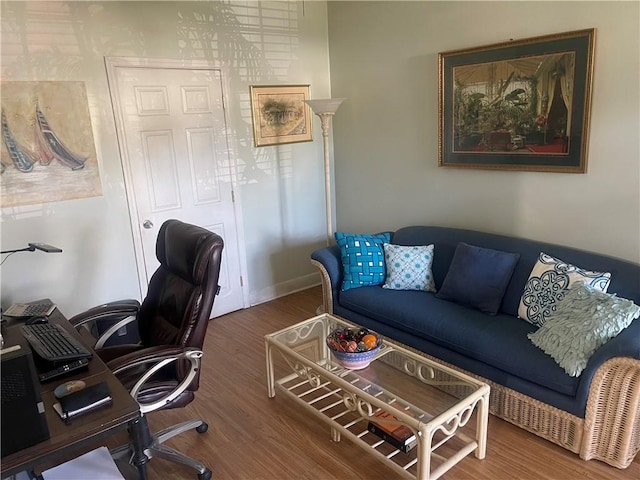 home office with wood-type flooring