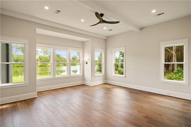 1241 Pikes Bluff Rd, Saint Simons Island, GA 31522 - spare room featuring ceiling fan, wood-type flooring, beamed ceiling, and recessed lighting