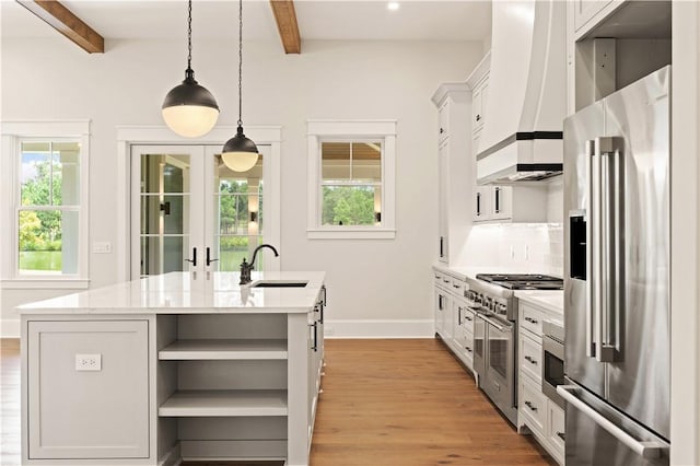 1241 Pikes Bluff Rd, Saint Simons Island, GA 31522 - kitchen featuring high quality appliances, open shelves, custom range hood, beam ceiling, and decorative backsplash