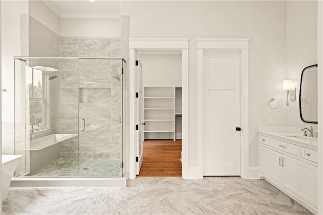 1241 Pikes Bluff Rd, Saint Simons Island, GA 31522 - full bath featuring a stall shower, marble look tiles, vanity, a freestanding bath, and crown molding