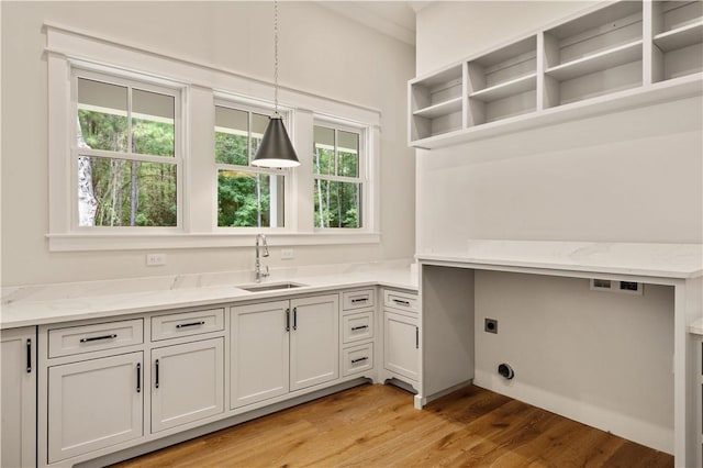 1241 Pikes Bluff Rd, Saint Simons Island, GA 31522 - laundry room featuring healthy amount of natural light, electric dryer hookup, and light wood-type flooring