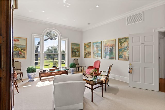 sitting room with light colored carpet and crown molding