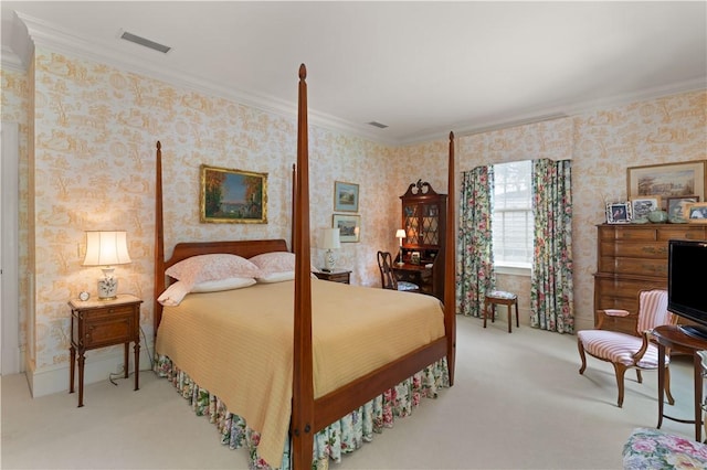 bedroom with ornamental molding and light carpet