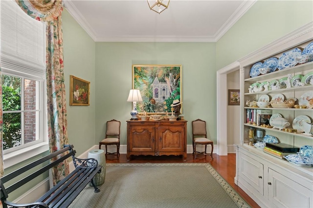 sitting room with dark hardwood / wood-style flooring and ornamental molding