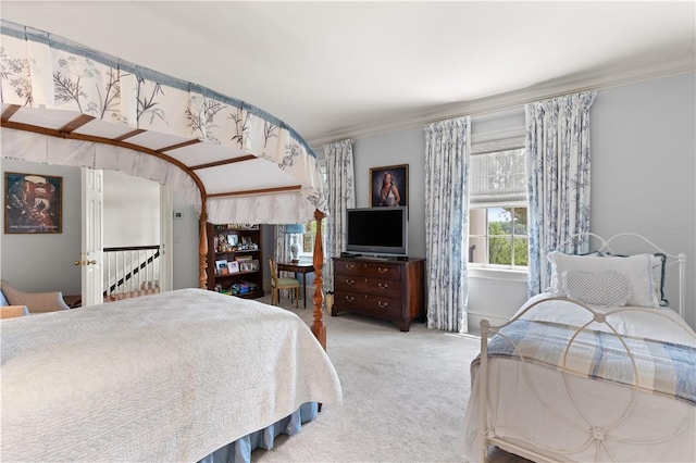 carpeted bedroom with crown molding