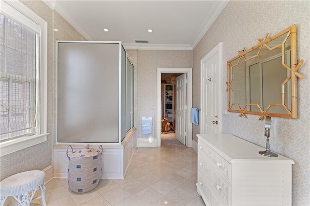 bathroom with a shower and crown molding