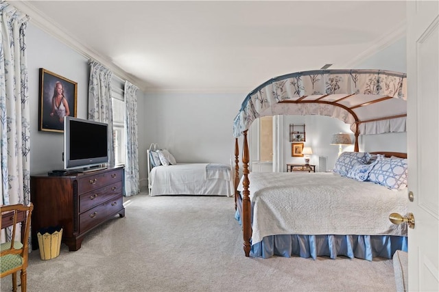 bedroom featuring light colored carpet and ornamental molding