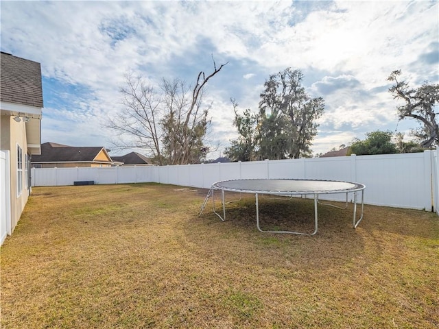 view of yard featuring a trampoline