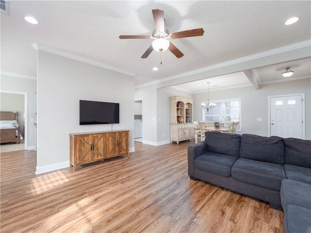 living room featuring ceiling fan with notable chandelier, light hardwood / wood-style flooring, and ornamental molding