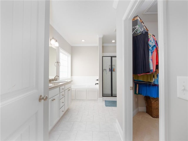 bathroom featuring vanity, crown molding, and plus walk in shower