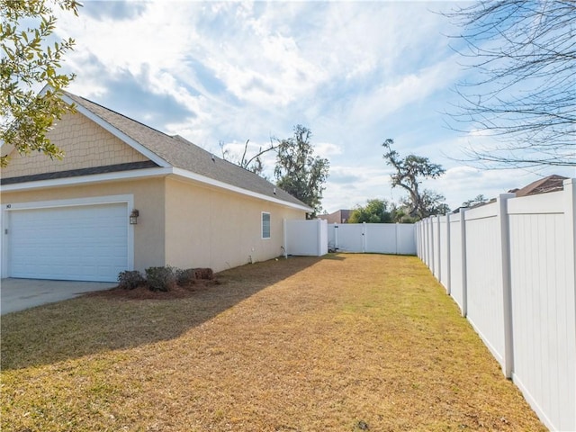 view of yard featuring a garage