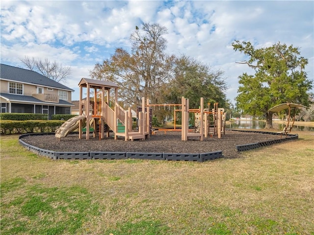 view of jungle gym with a water view and a yard