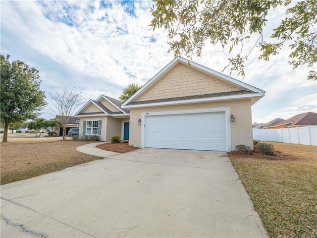 view of front of home featuring a garage and a front lawn