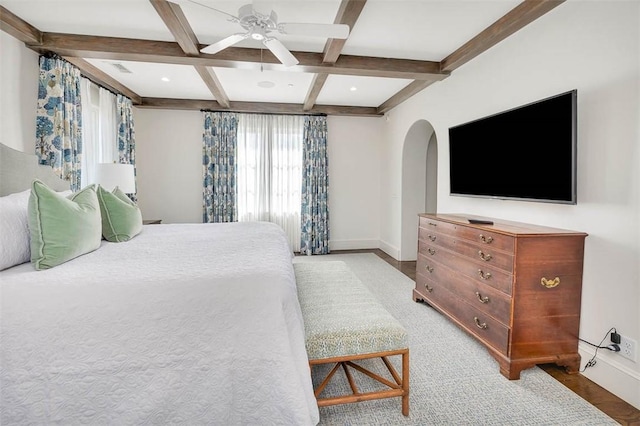 bedroom with ceiling fan, hardwood / wood-style floors, beamed ceiling, and coffered ceiling