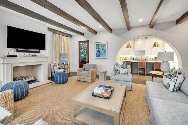 living room featuring hardwood / wood-style floors and beam ceiling