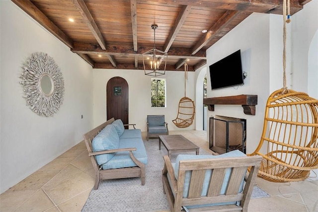 tiled living room featuring beam ceiling, wood ceiling, and a notable chandelier