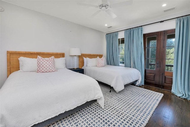 bedroom featuring dark hardwood / wood-style flooring, access to outside, and ceiling fan