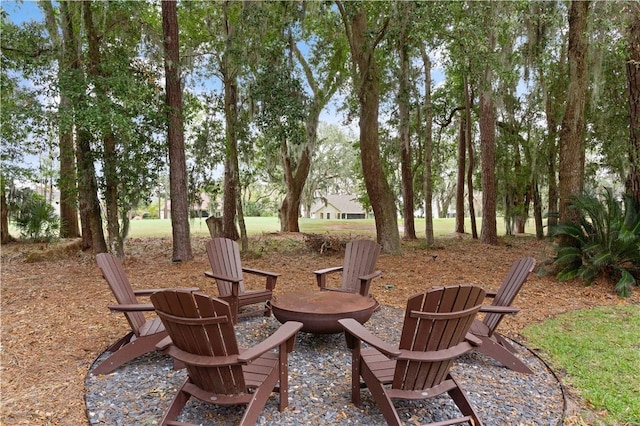 view of patio / terrace featuring an outdoor fire pit