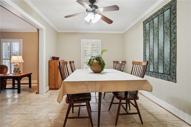 dining room featuring crown molding and ceiling fan