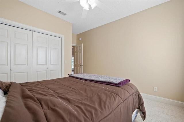 carpeted bedroom featuring a closet and ceiling fan