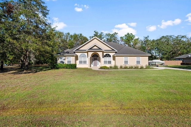 view of front of house featuring a front lawn and covered porch