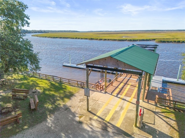 view of dock with a water view and a rural view