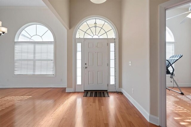 entrance foyer with ceiling fan and light hardwood / wood-style floors