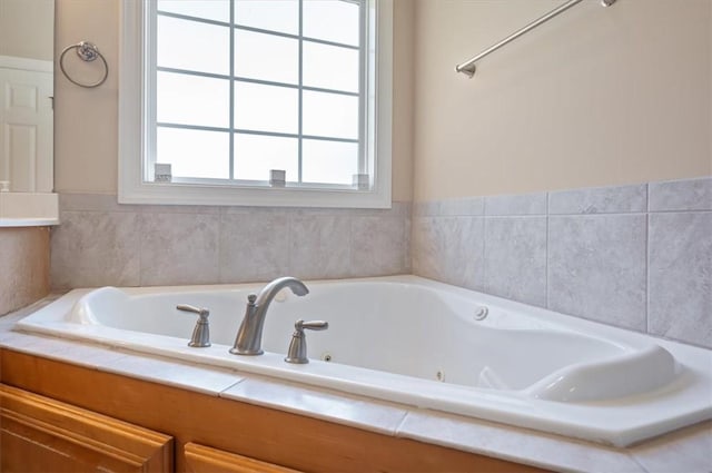 bathroom with a relaxing tiled tub