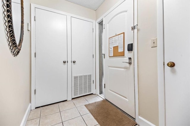 view of tiled foyer entrance