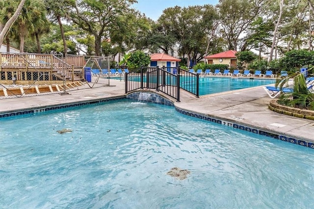 view of pool featuring pool water feature