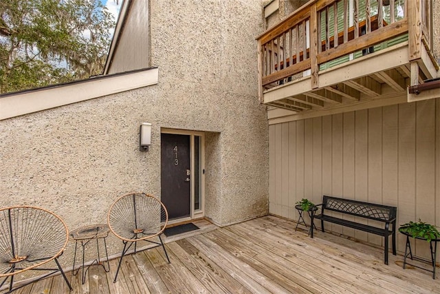 entrance to property with a wooden deck