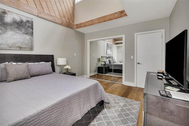 bedroom featuring hardwood / wood-style flooring and a closet