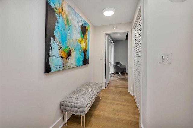 hallway with light wood-type flooring