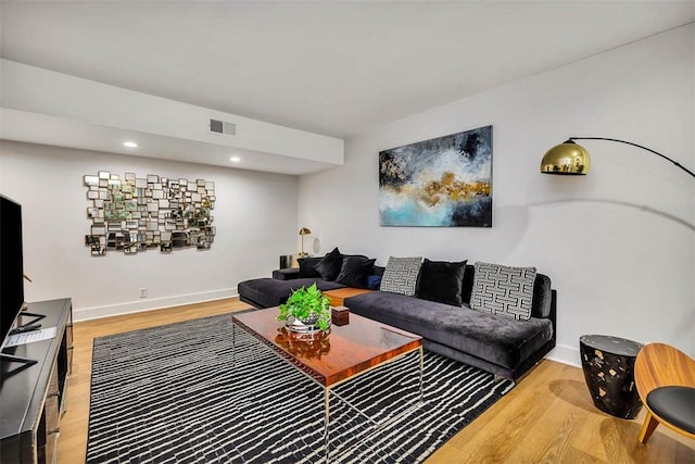 living room with light hardwood / wood-style flooring